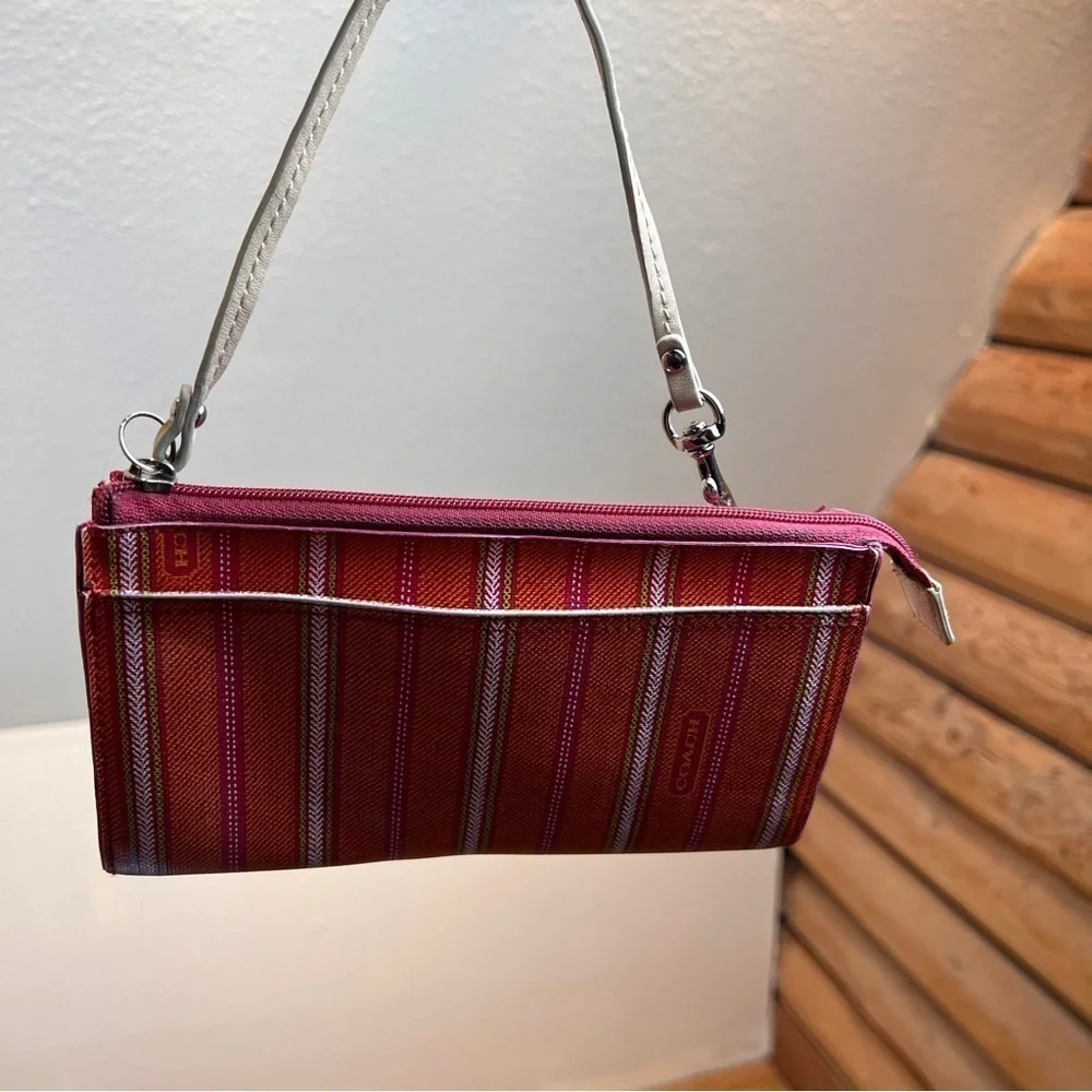 COACH WRISTLET. Cute orange,red,blue&cream stripe w/lots of pockets. 4”X7-½”